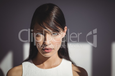 Beautiful woman looking at camera in office