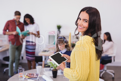 Portrait of smiling businesswoman in office