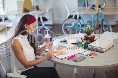 Businesswoman working at desk in office