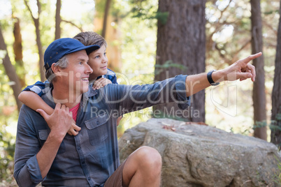 Father showing something to curious boy