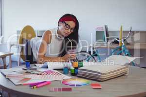Focused businesswoman working in creative office