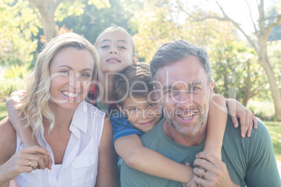 Happy family in park on a sunny day