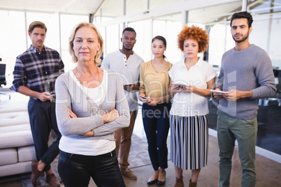 Portrait of confident colleagues in office