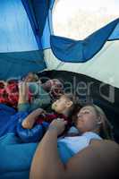 Family sleeping in the tent