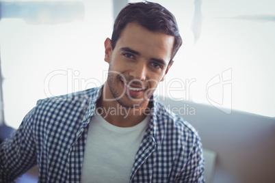 Smiling male graphic designer in office