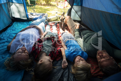 Family lying in the tent