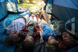 Family lying in the tent