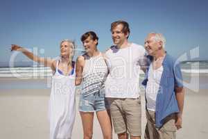 Happy family looking away while standing side by side