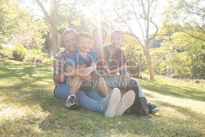 Happy family sitting in the park