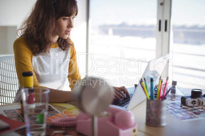 Young businesswoman working at office