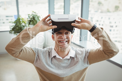 Portrait of happy executive using virtual reality headset