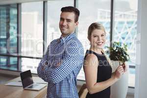 Portrait of smiling executives standing together