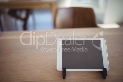 Close-up of digital tablet on wooden desk