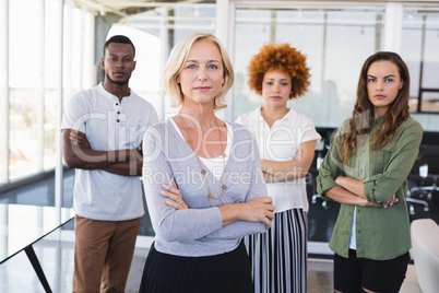 Portrait of confident business people with arms crossed