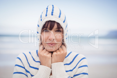 Portrait of woman wearing hooded sweater during winter