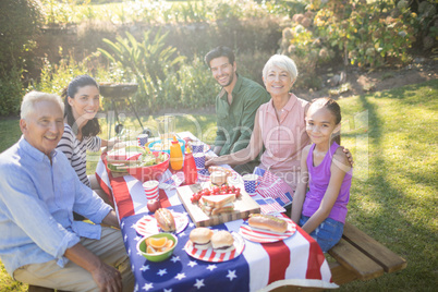 Family having meal in the park on a sunny day