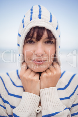 Close up portrait of woman wearing hooded sweater during winter