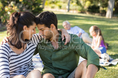 Romantic couple embracing each other in the park