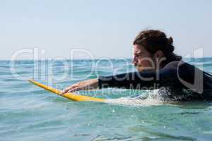 Surfer surfboarding in the sea