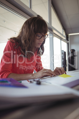 Female interior designer making diagrams on paper