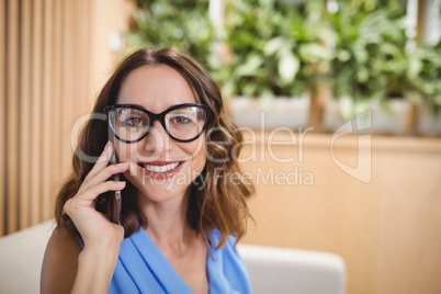 Portrait of executive talking on mobile phone