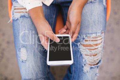Overhead view of businesswoman using phone