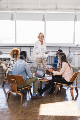 Businesswoman with team at creative office