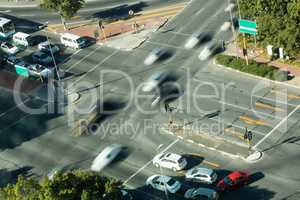 Blurred motion of cars on road intersection