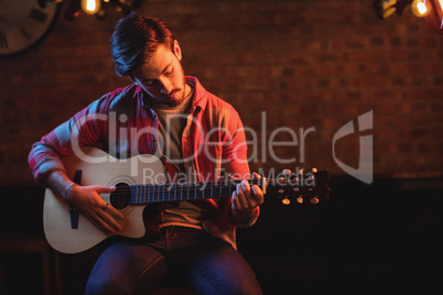 Young man playing guitar