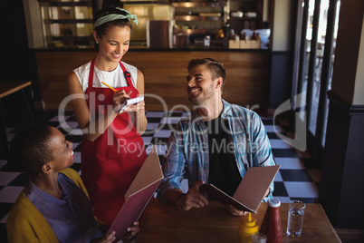 Waitress taking order at restaurant