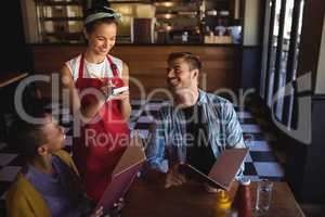 Waitress taking order at restaurant