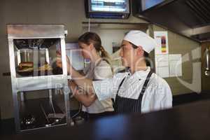 Chef looking at an order list in the commercial kitchen