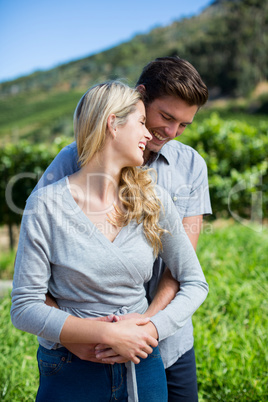 Cheerful young couple embracing