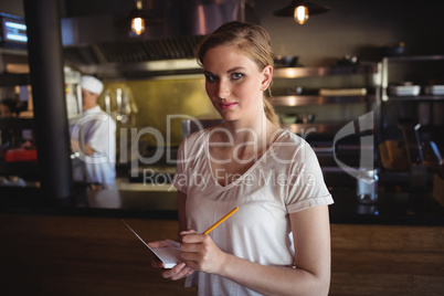Waitress taking order at restaurant