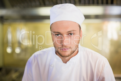 Serious male chef in commercial kitchen