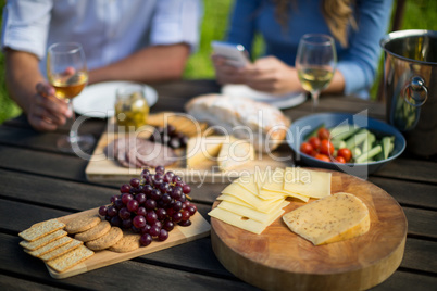 High angle view of breakfast by couple at wooden table