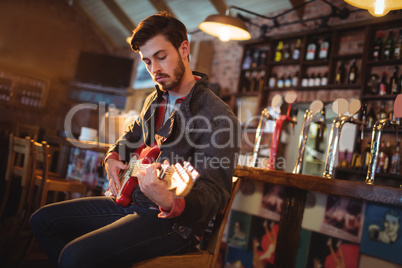 Young man playing guitar