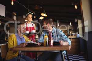 Waitress interacting with customer