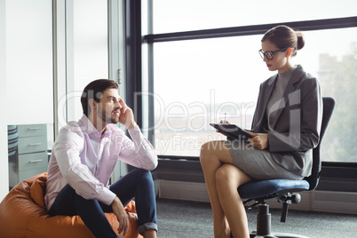 Unhappy man talking to counselor