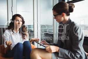 Unhappy woman consulting counselor