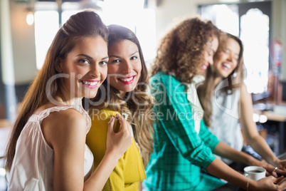 Female friends sitting in cafe