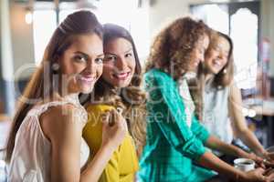 Female friends sitting in cafe