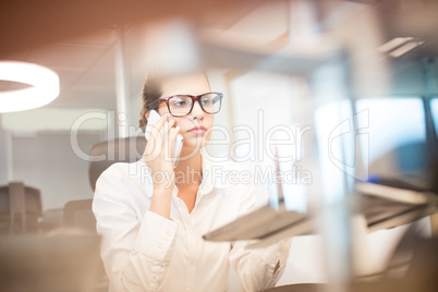 Young businesswoman talking on mobile phone