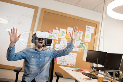 Businessman screaming while experiencing virtual reality