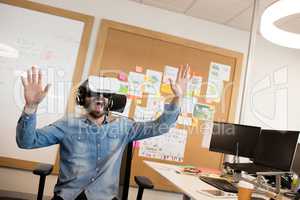 Businessman screaming while experiencing virtual reality