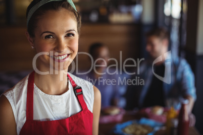 Smiling waitress at restaurant