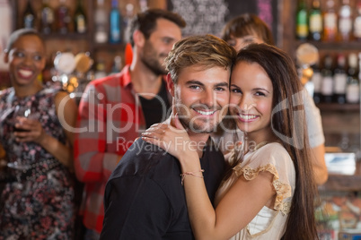 Portrait of young couple embracing