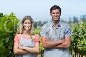 Portrait of smiling couple at vineyard