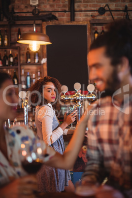 Jealous woman looking at couple flirting with each other