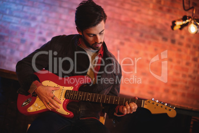 Young man playing guitar